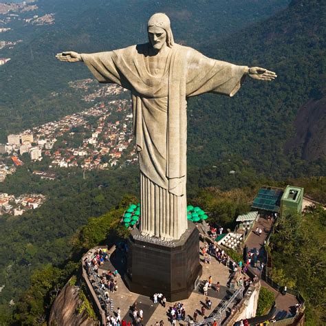 the statue of christ the redeemer looks over this city|Christ the Redeemer .